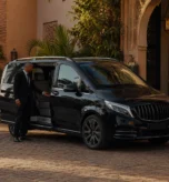 Daily driver service cost in Marrakech with private chauffeur outside a luxury riad