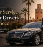 Professional chauffeur standing beside a luxury black Mercedes in Morocco for private driver and airport transfer service